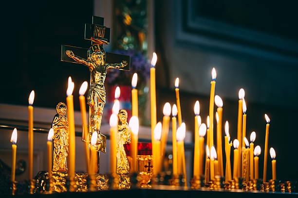 istock Church candles at dark background 498259216