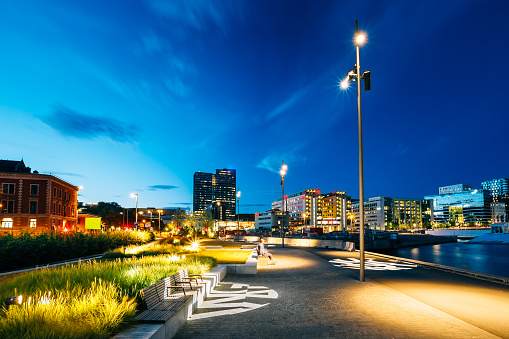 Night view of the city's waterfront, illuminated lanterns in the Oslo city center, Norway.