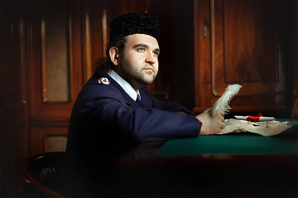istock Man behind the desk writing pen. 498261350