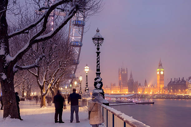 Snowy Jubilee Gardens and Westminster Palace in London stock photo
