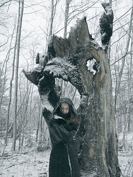 istock girl in winter forest 498274724