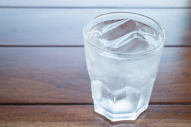 istock Glass of cold water on wooden table 498276298