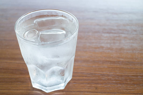 istock Glass of cold water on wooden table 498276496