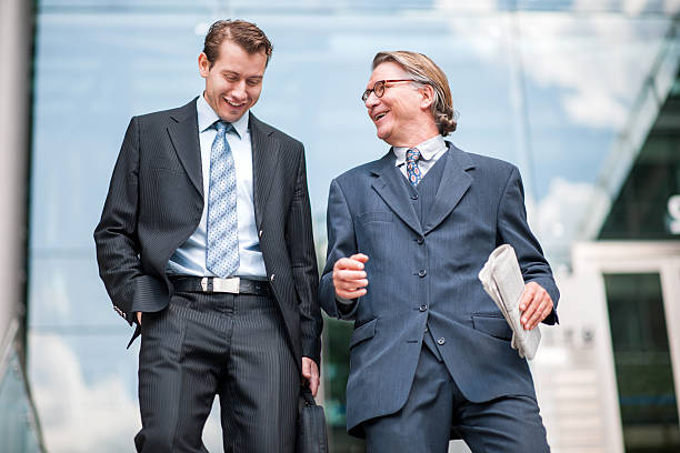 istock Happy businessmen walking outdoors and communicating. 498276650