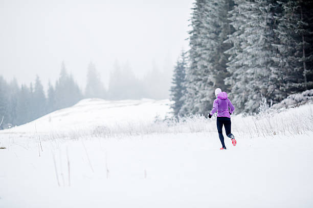 istock Running woman, winter jogging inspiration and motivation 498278596