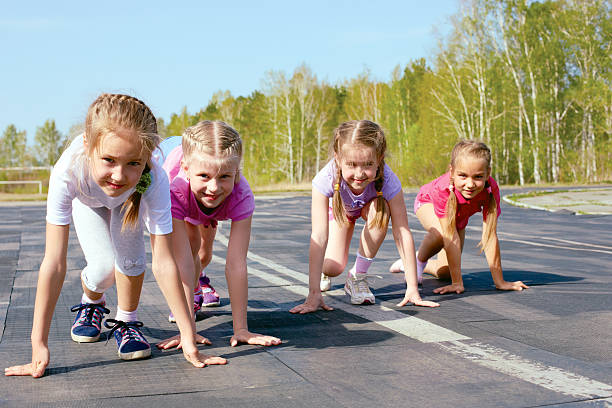 istock girls starting to run on track 498278757