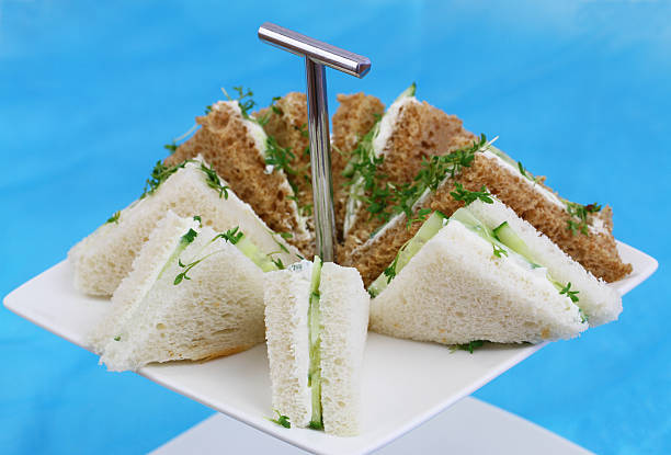 istock White and brown cream cheese sandwiches on cake tray 498279830