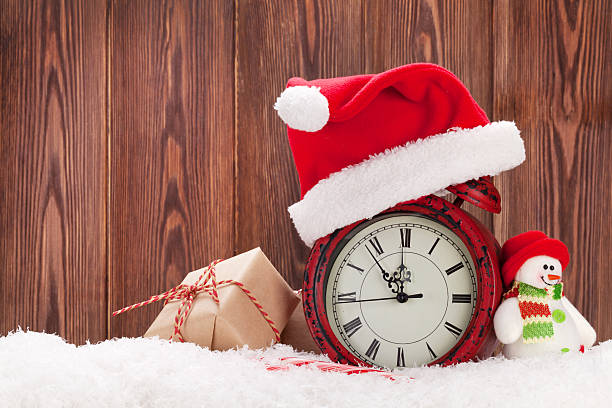 istock Christmas gift box, snowman and alarm clock 498279970