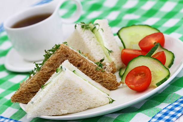 istock White and brown cream cheese sandwiches with green side salad 498280596
