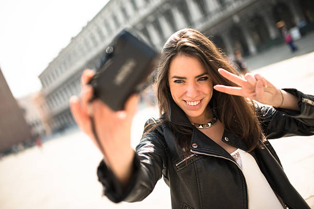 istock tourist make a selfie in venice 498280632