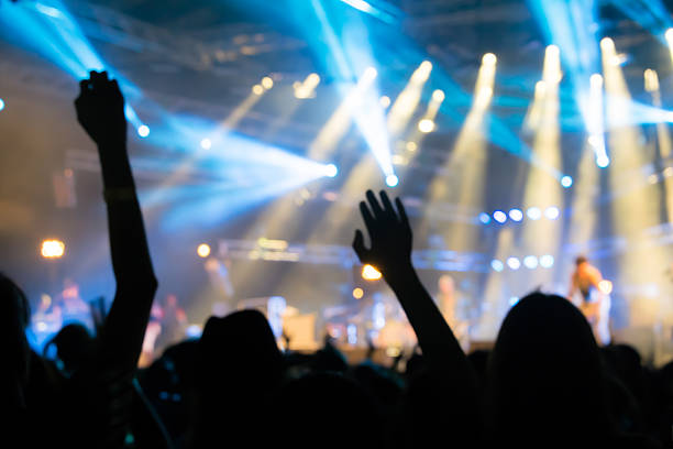 istock Bokeh lighting in outdoor concert with cheering audience 498280684