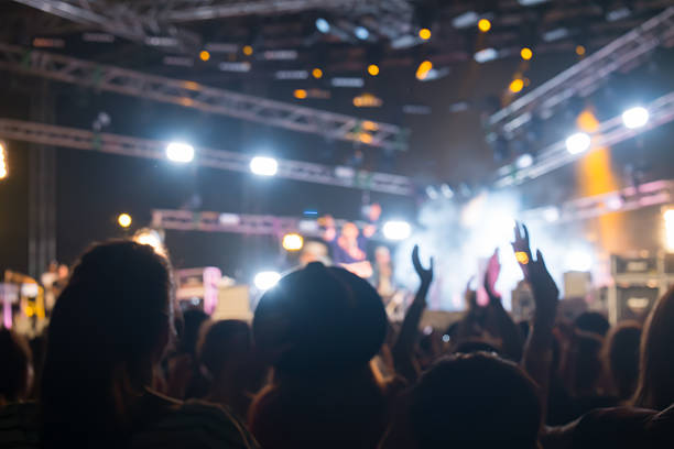 istock Bokeh lighting in outdoor concert with cheering audience 498280848