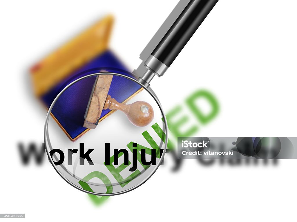 injury Top view of a rubber stamp with a giant word "Work injury claim - denied  "  isolated on white background 2015 Stock Photo