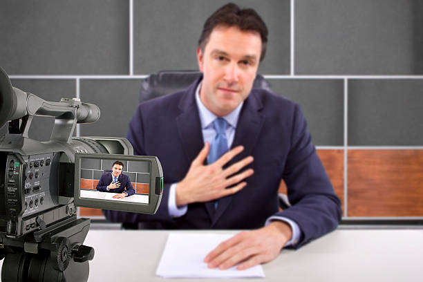 istock Camera Filming a Reporter or Anchorman in a Studio 498281629