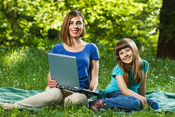 istock Mother and daughter using laptop 498283293