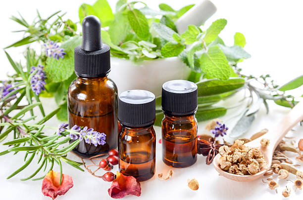alternative therapy with herbs and essential oils stock photo