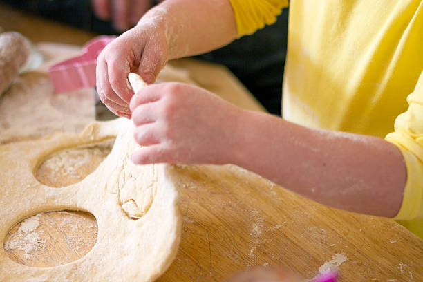 istock Child cutting shapes in dough. 498285190
