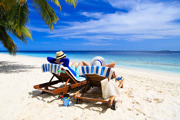 istock happy couple relax on a tropical beach 498301868