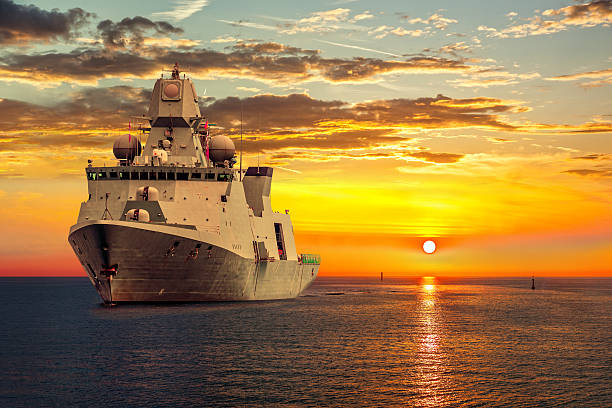 Warship The military ship on sea at sunrise. destroyer photos stock pictures, royalty-free photos & images