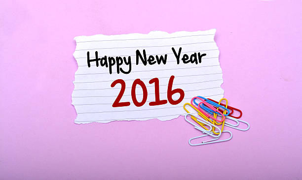 istock Happy New Year 2016 Wrrite on Paper with pink Backdrop 498302222