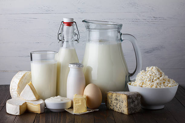 istock Dairy products on wooden table 498302698