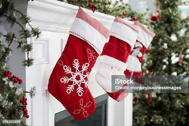 Empty Stockings Hung On Fireplace On Christmas Eve Stock Photo - Download Image Now - Christmas Stocking, Christmas, Fireplace