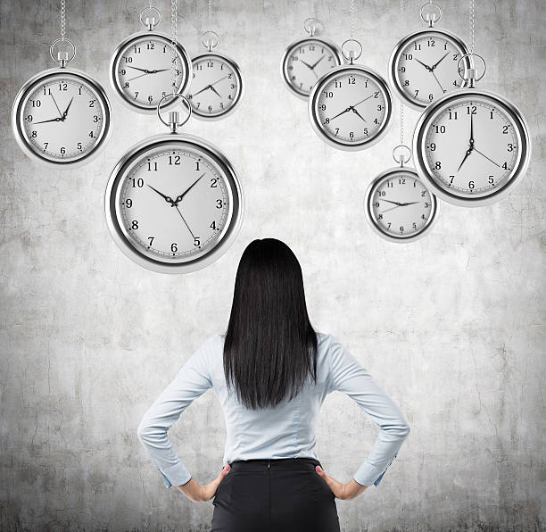 istock lady who is looking at hovering pocket watches in air 498303868