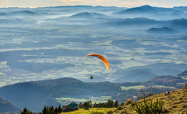 istock Paraglider is flying in the valley 498304008