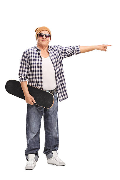 istock Cool senior skater pointing with his hand 498305598
