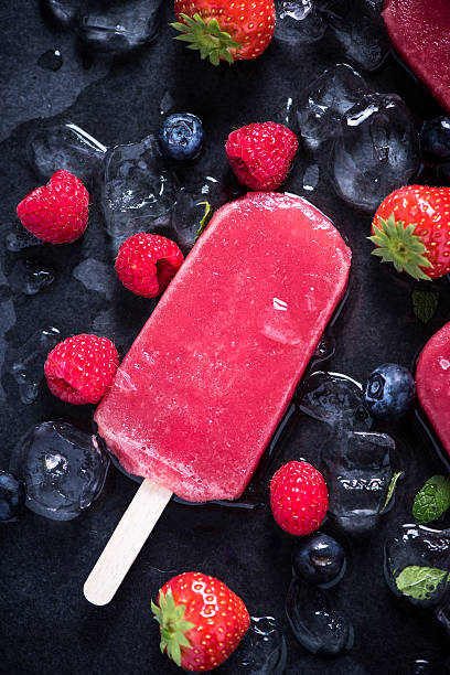 istock Refreshing popsicle on ice cubes and fruits 498305980