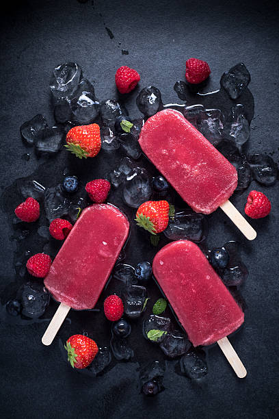 istock Refreshing popsicle on ice cubes and fruits 498306082