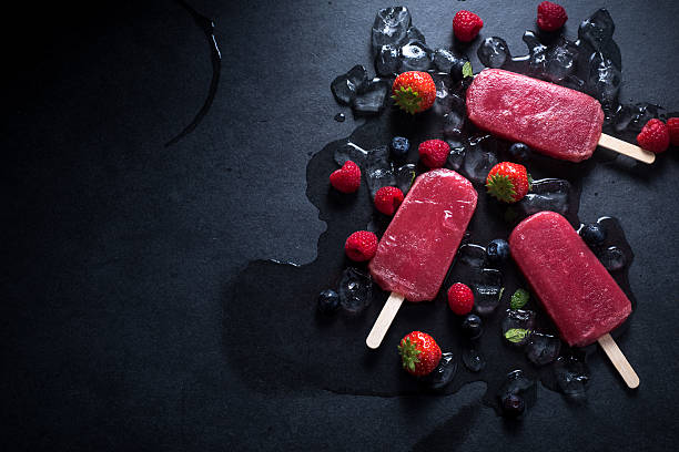istock Refreshing popsicle on ice cubes and fruits 498306182