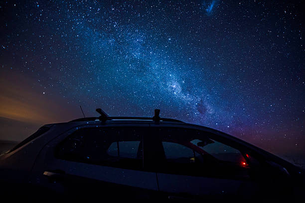 Milky way and stars reflection on the car Milky way and stars reflection on the car at night great ocean road photos stock pictures, royalty-free photos & images