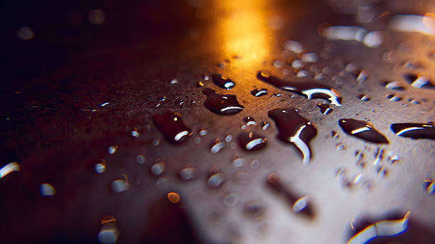 Rain drops on a surface. Abstract background stock photo