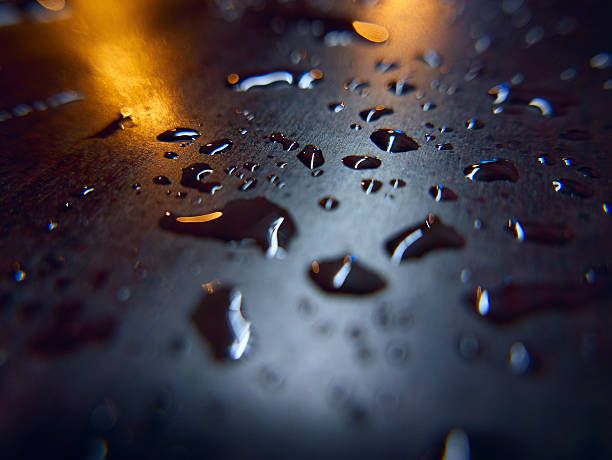 Rain drops on a surface. Abstract background stock photo