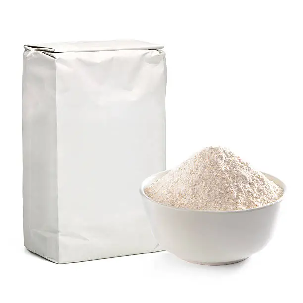 Blank flour package with bowl on white background