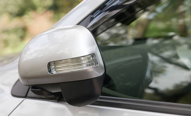 istock Side rear-view mirror closed for safety at car park 498311850