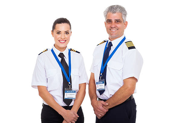 istock commercial airline captain and first officer on white background 498314191