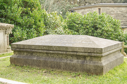 BOURNEMOUTH, ENGLAND - MARCH 1, 2014: Grave bearing the remains of famous poets, writers and thinkers in the churchyard of St Peter's Church, Bournemouth.  Buried here are Frankenstein author Mary Shelley (1797 - 1851), political thinker william Godwin (1756 - 1836), feminist Mary Wollstonecraft (1759 - 1797) and the heart of romantic poet Percy Bysshe Shelley (1792 - 1822).