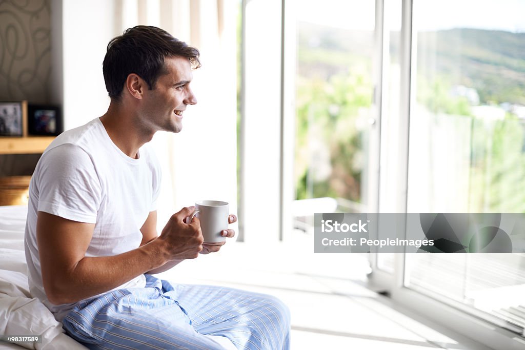 Some coffee before I get dressed Cropped shot of a handsome young man drinking coffee on the edge of his bedhttp://195.154.178.81/DATA/i_collage/pi/shoots/783486.jpg Men Stock Photo