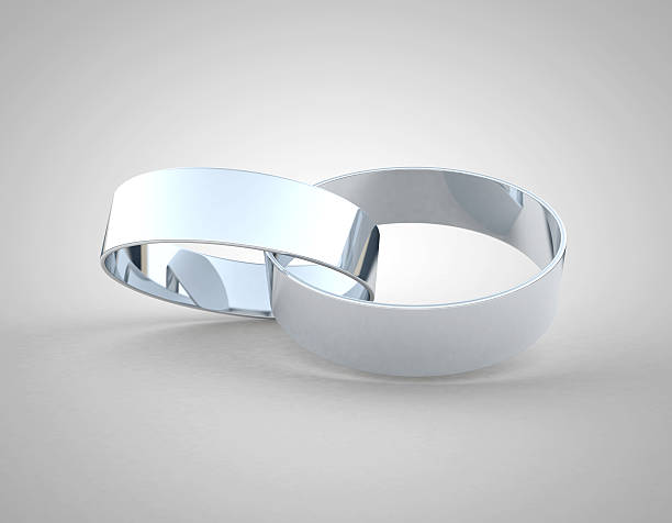 istock White gold or platinum wedding rings linked together 498318863