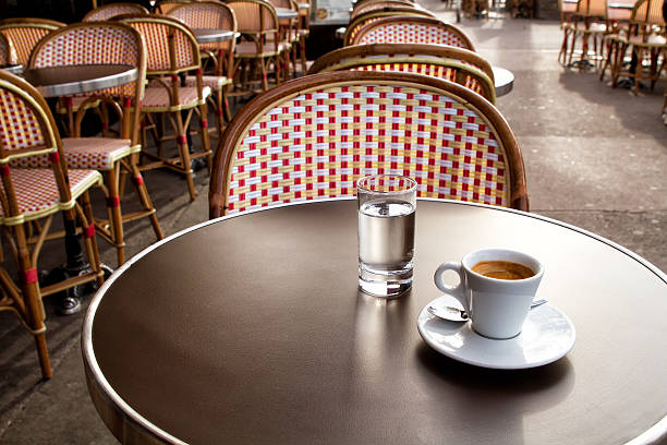 istock Coffee and water on a table of parisian's bar 498318959