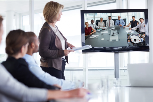 Businesswoman giving presentation in conference meeting