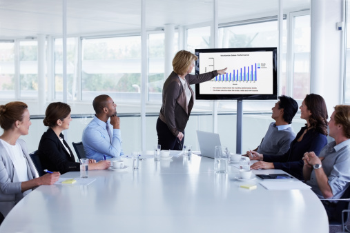 Businesswoman giving presentation in meeting photo
