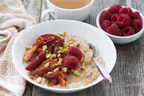 istock oatmeal with baked fruit for breakfast on wooden table 498332340