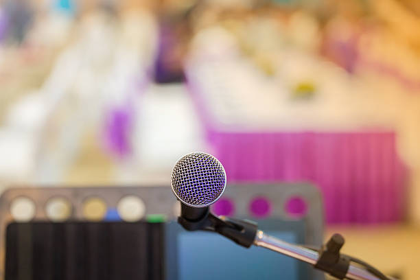 istock Close up of microphone in concert hall 498333176