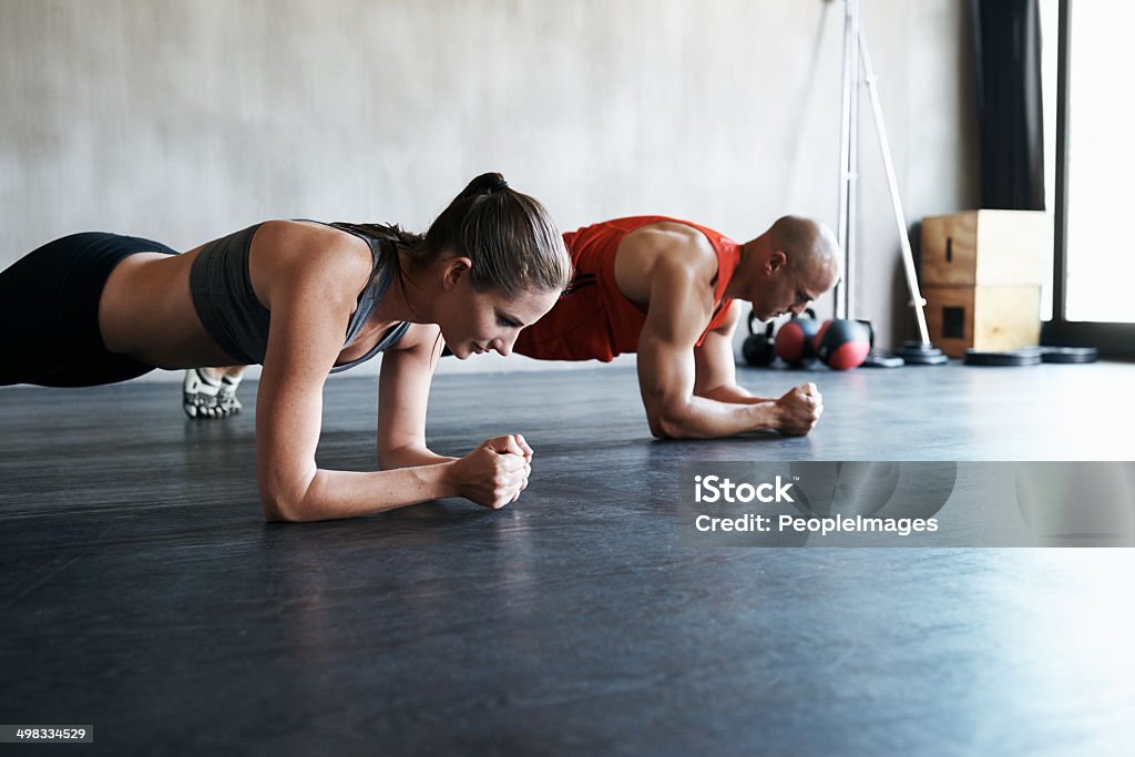 Looking forward to the reward of a long, healthy life Shot of a young man and woman working outhttp://195.154.178.81/DATA/i_collage/pi/shoots/783431.jpg Plank - Timber Stock Photo