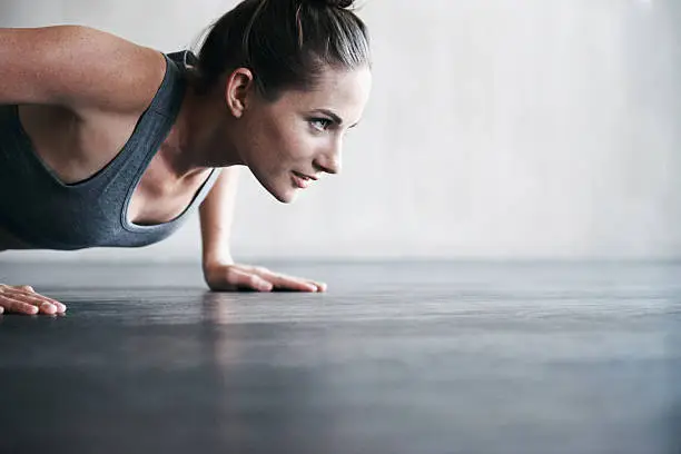 Shot of an attractive young woman working out at the gymhttp://195.154.178.81/DATA/i_collage/pi/shoots/783431.jpg