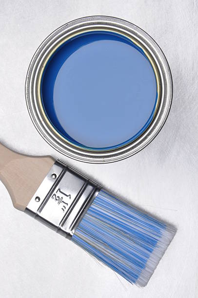 istock Top view of blue paint can with brush 498334828