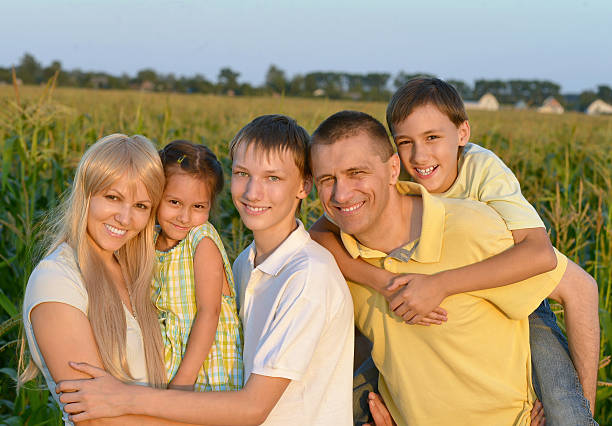 istock Happy family in wheat field 498334940